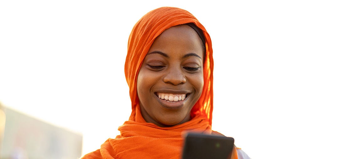 woman smiling at cellphone