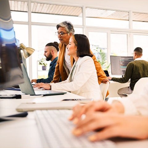 A team of people working in an open concept office