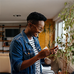 Young woman smiling while working on computer
