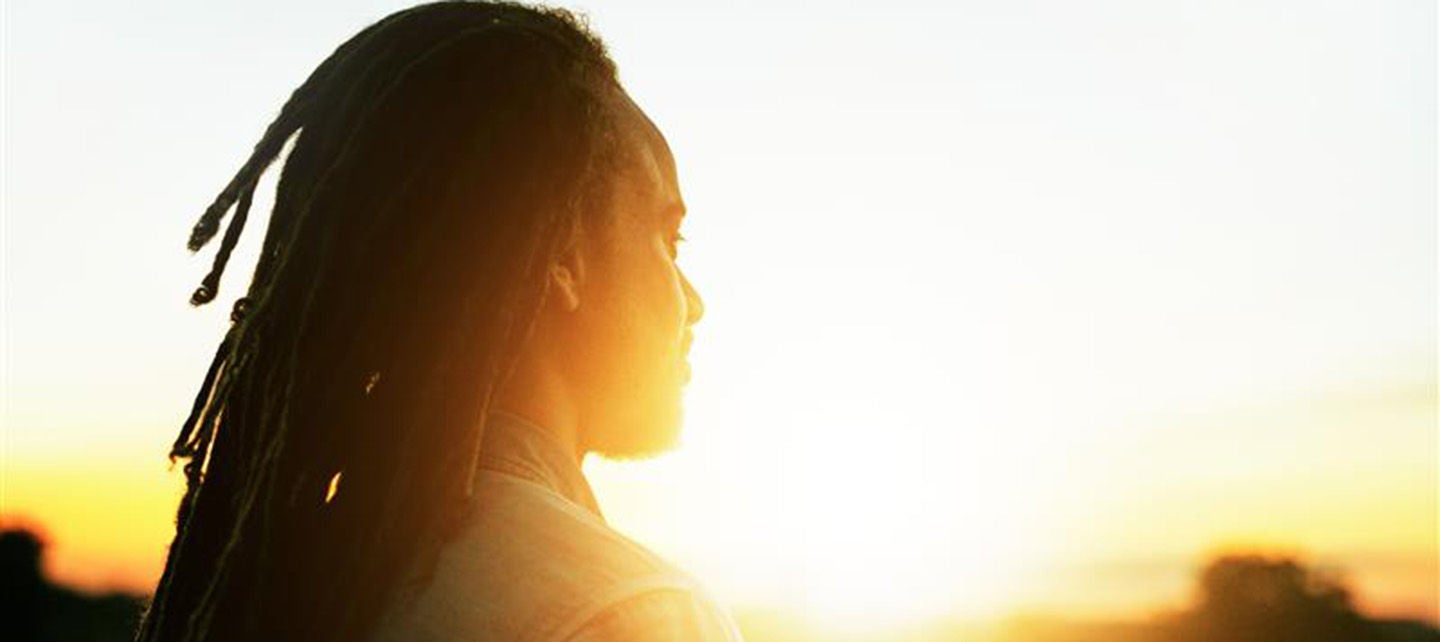 Man smiling working on laptop