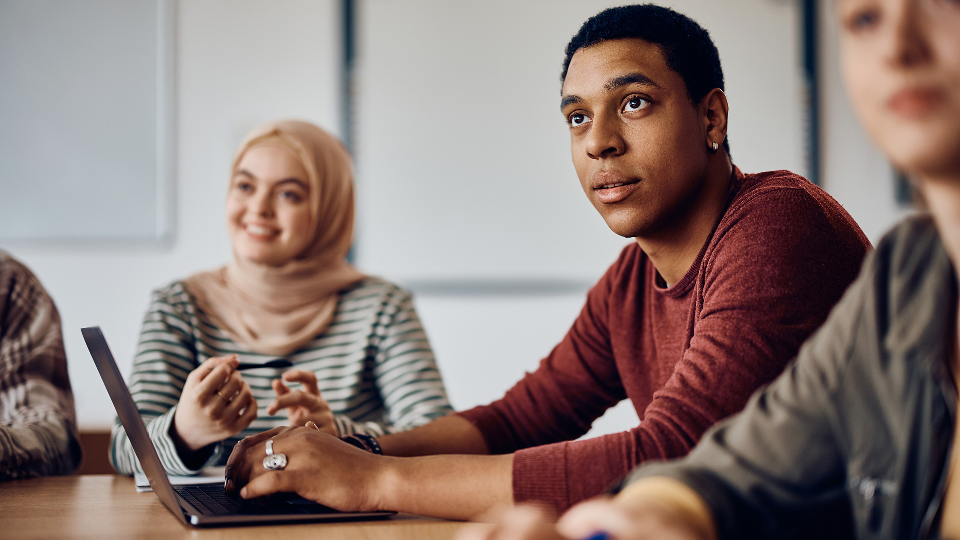 A group of people sitting around a table