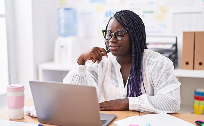 Woman investigating on her laptop