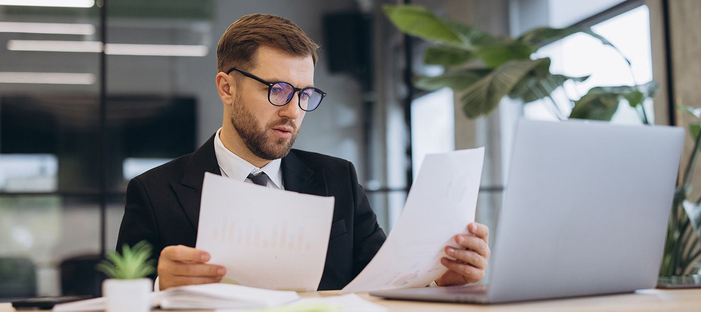 Man reviewing reports