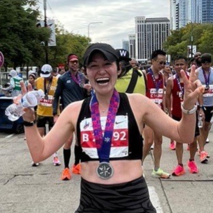 Rachel Thompson at the end of a marathon