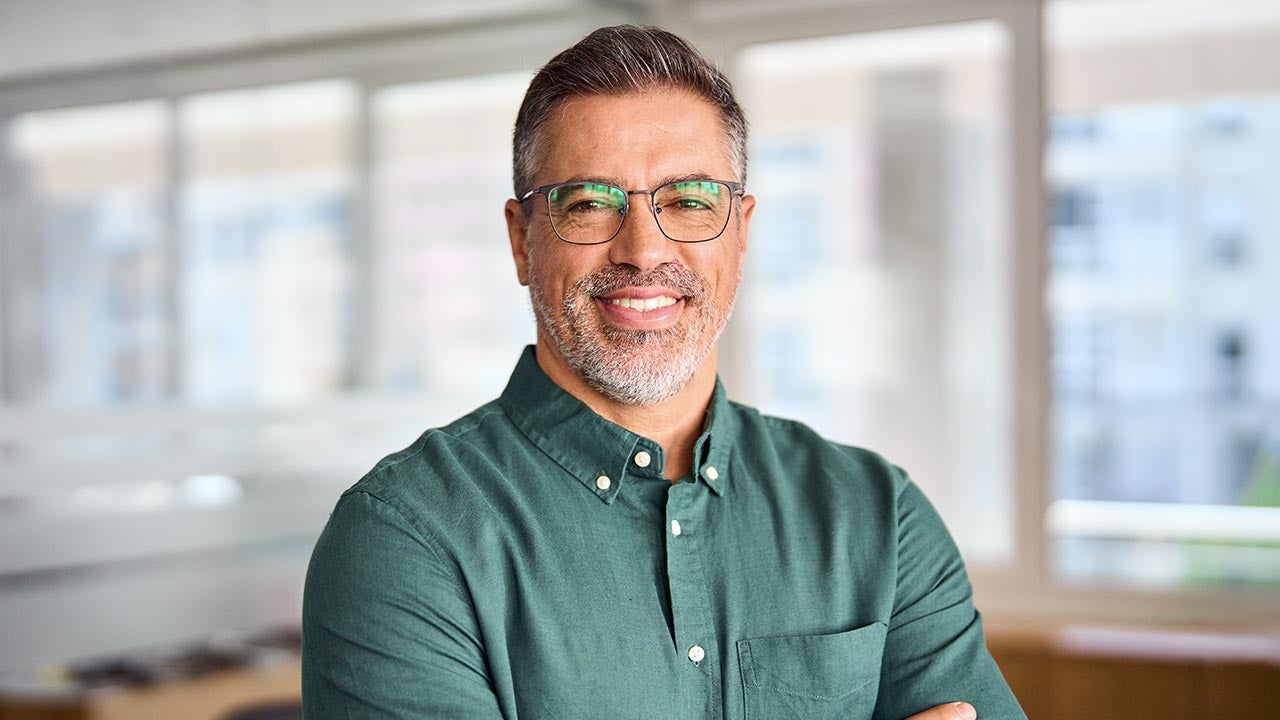 Man standing in office.