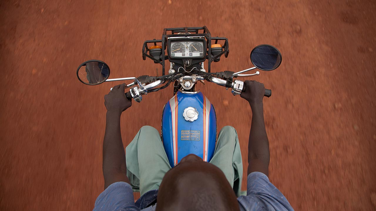Cheerful young woman talking to friend.