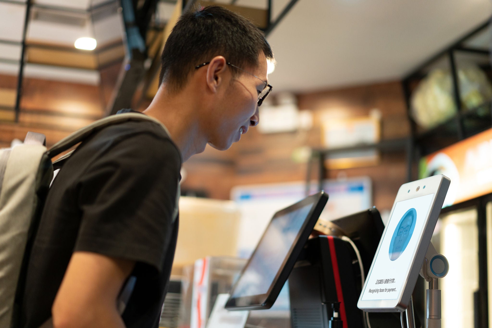 Man at airport using face scan