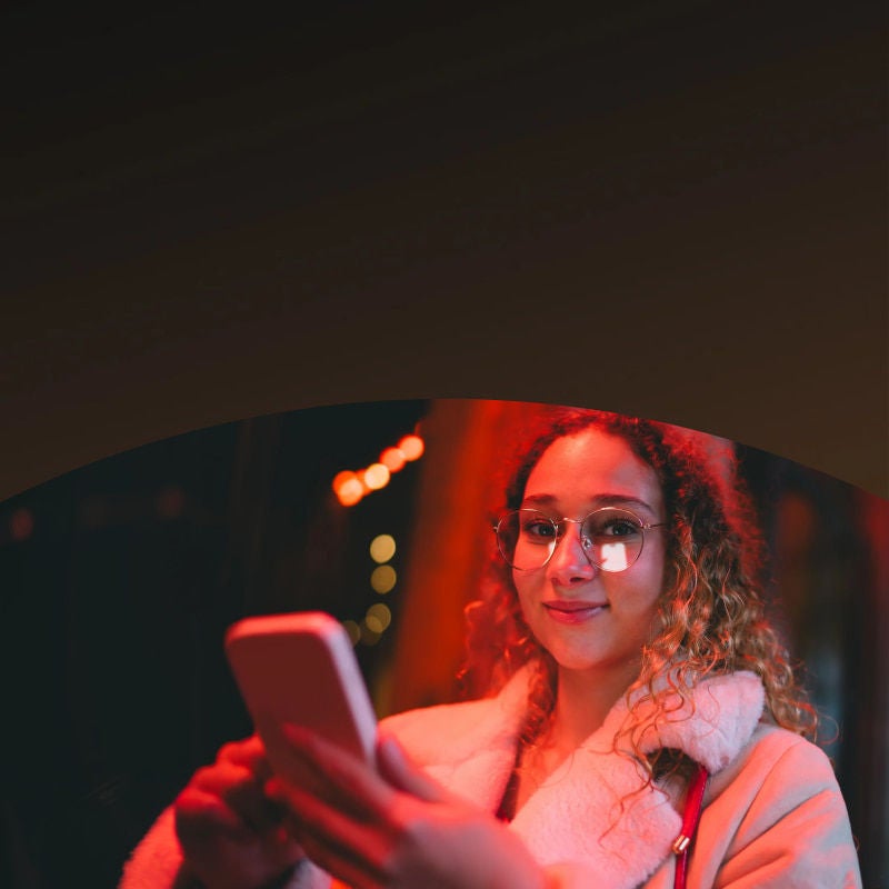 curly haired woman with glasses