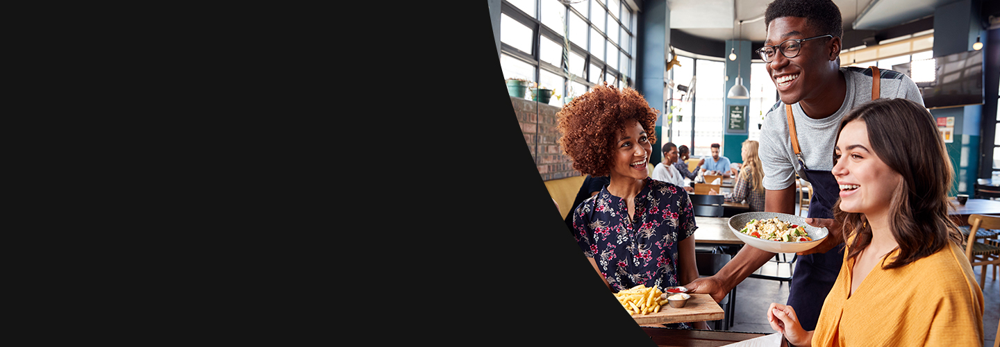 People sitting at a table eating food
