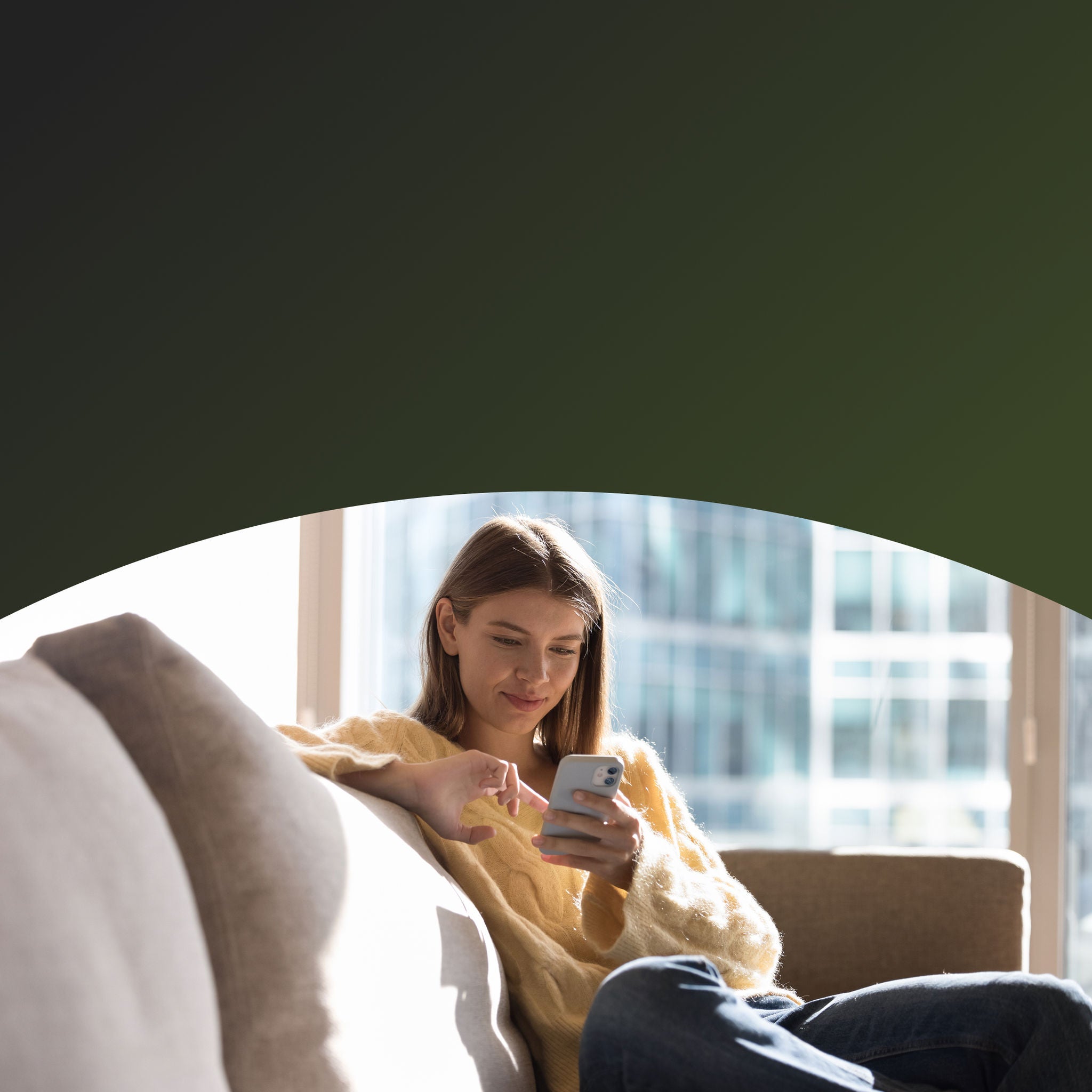 Woman on her phone on the couch