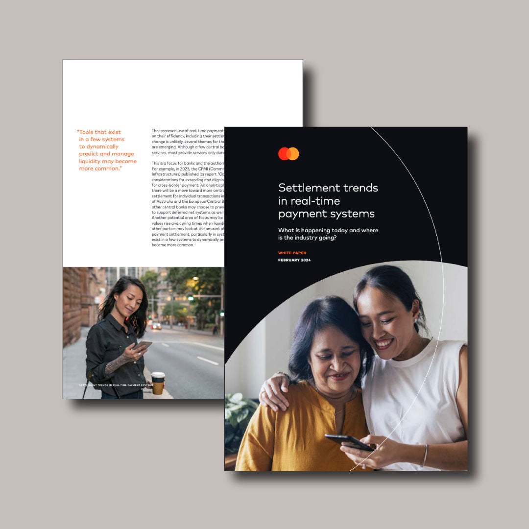 Front page of a report showing two women looking at smartphone.