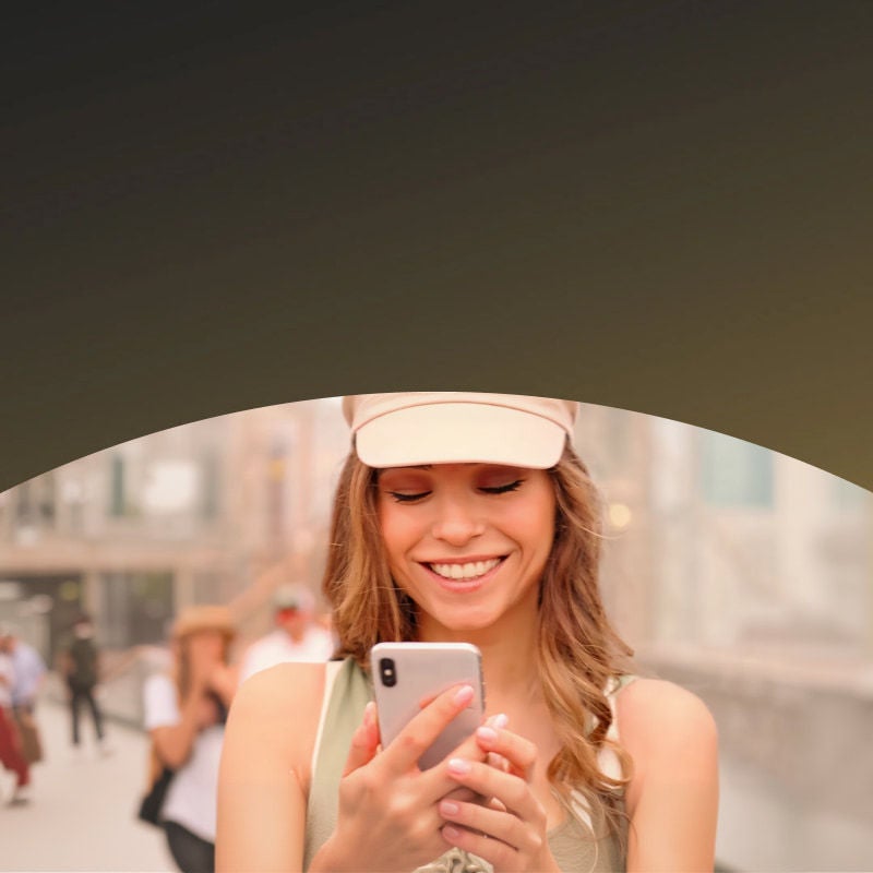 women with phone smiling