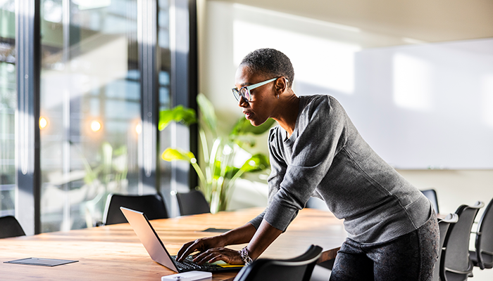 Woman looking at data on her computer