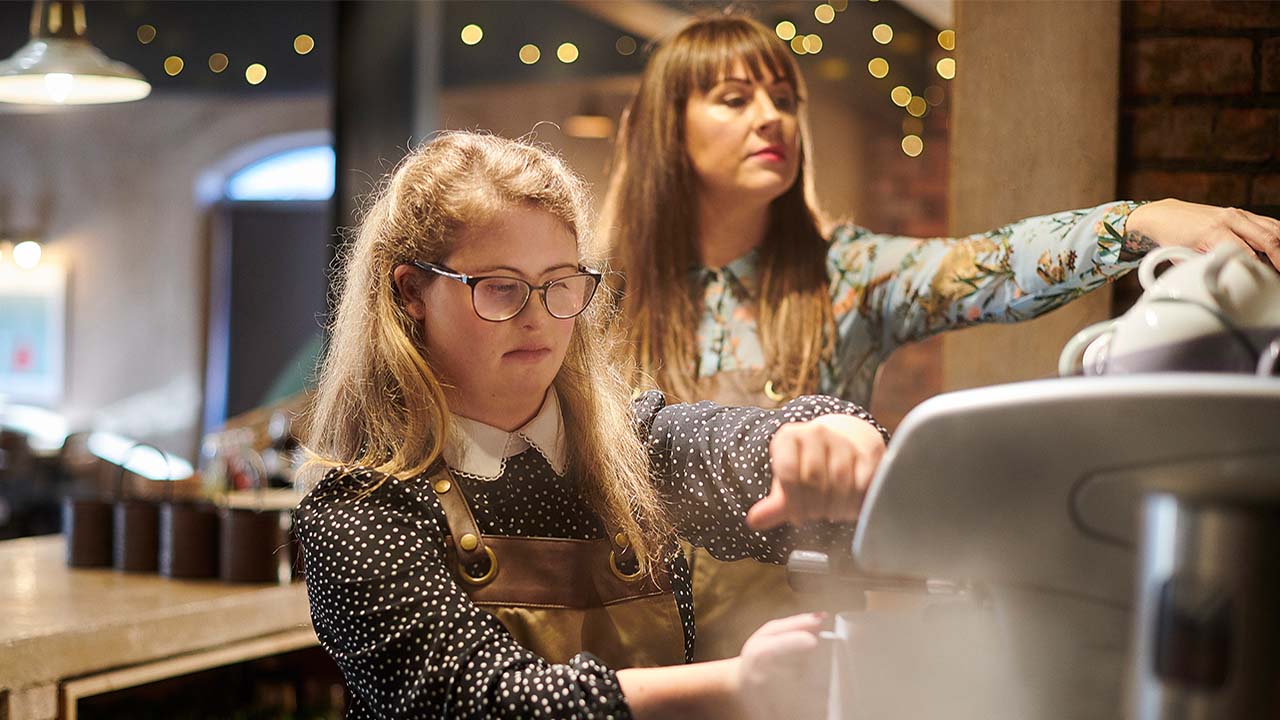 Girls getting coffee.
