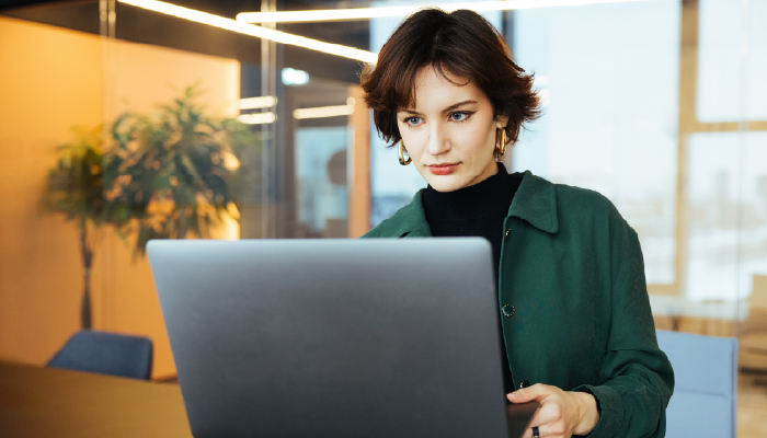 Woman on her computer looking at data