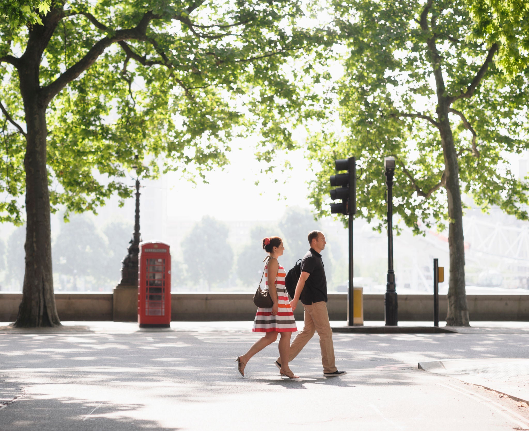 "Couple walking together on urban street, London, United Kingdom"