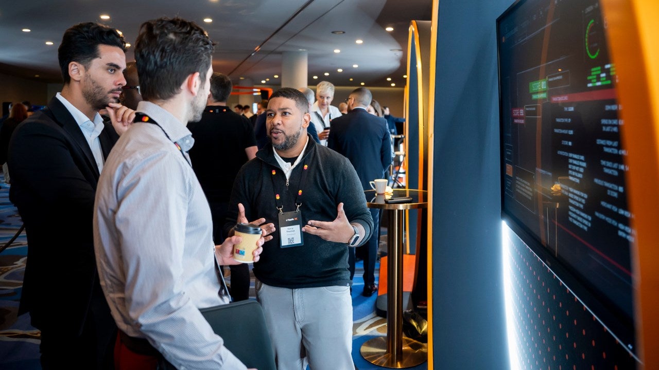 Kerry Thomas demonstrates a cyber solution at RiskX cybersecurity conference. 