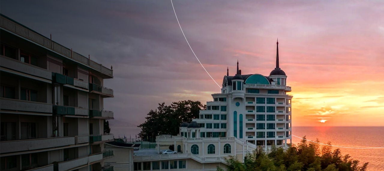 seaside hotel at sunset horizon