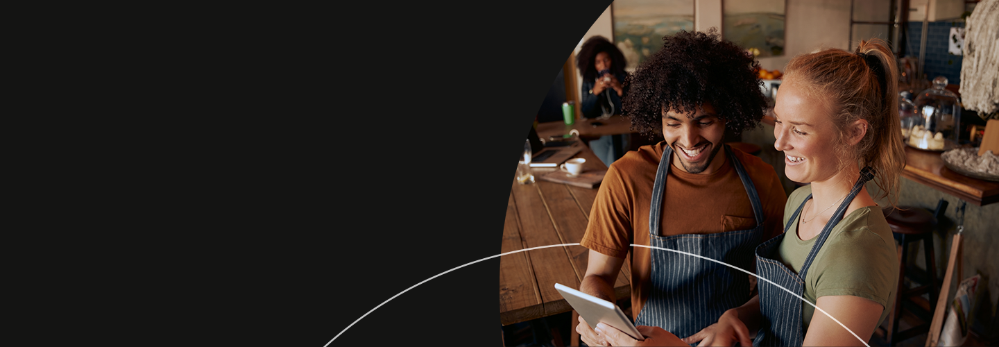 Smiling people working in a cafe