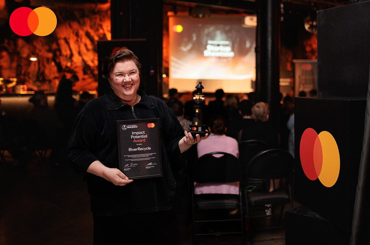 riverrecycle winner holding award trophy