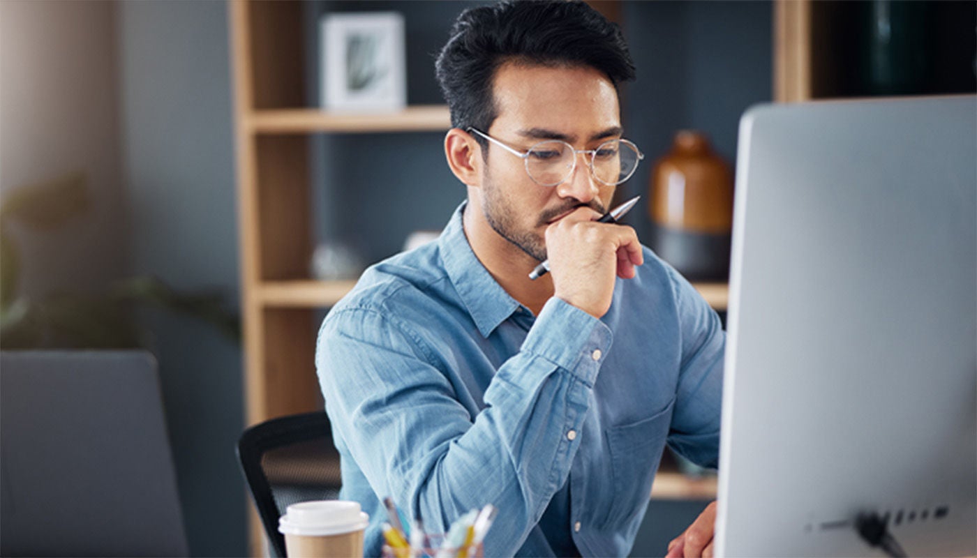Man thinking while using computer