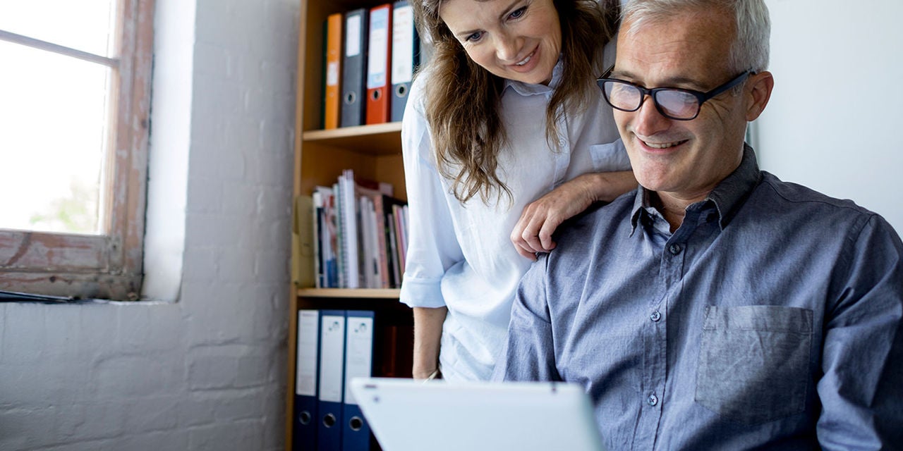 Couple looking at a tablet