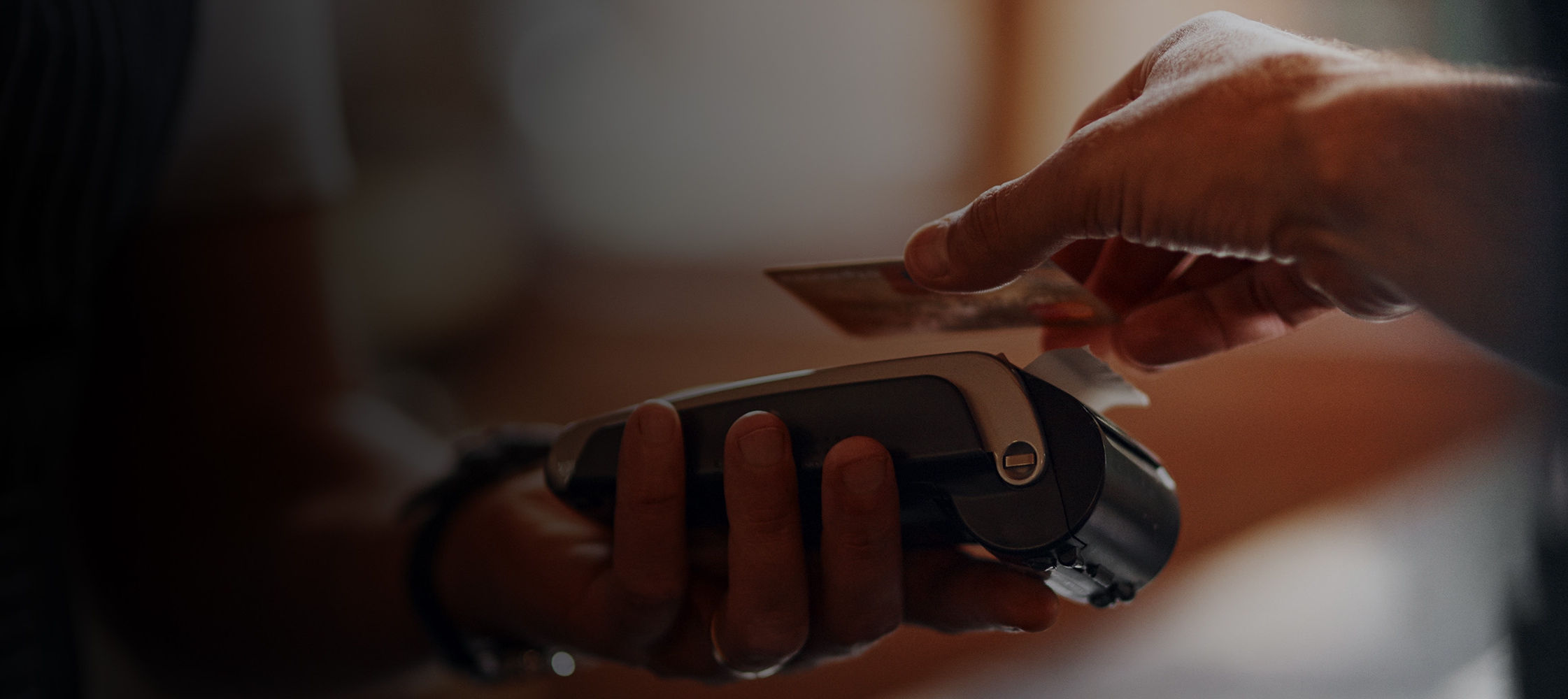 Someone paying with contactless payment at a restaurant