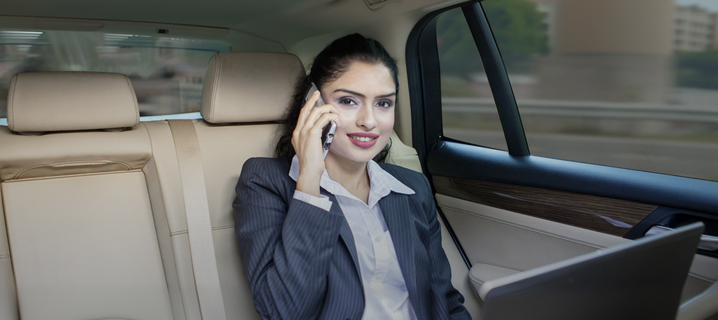 India business woman on a car