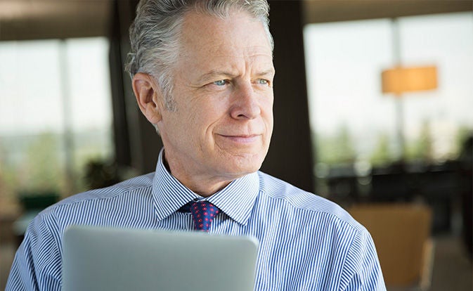 Senior businessman using a tablet