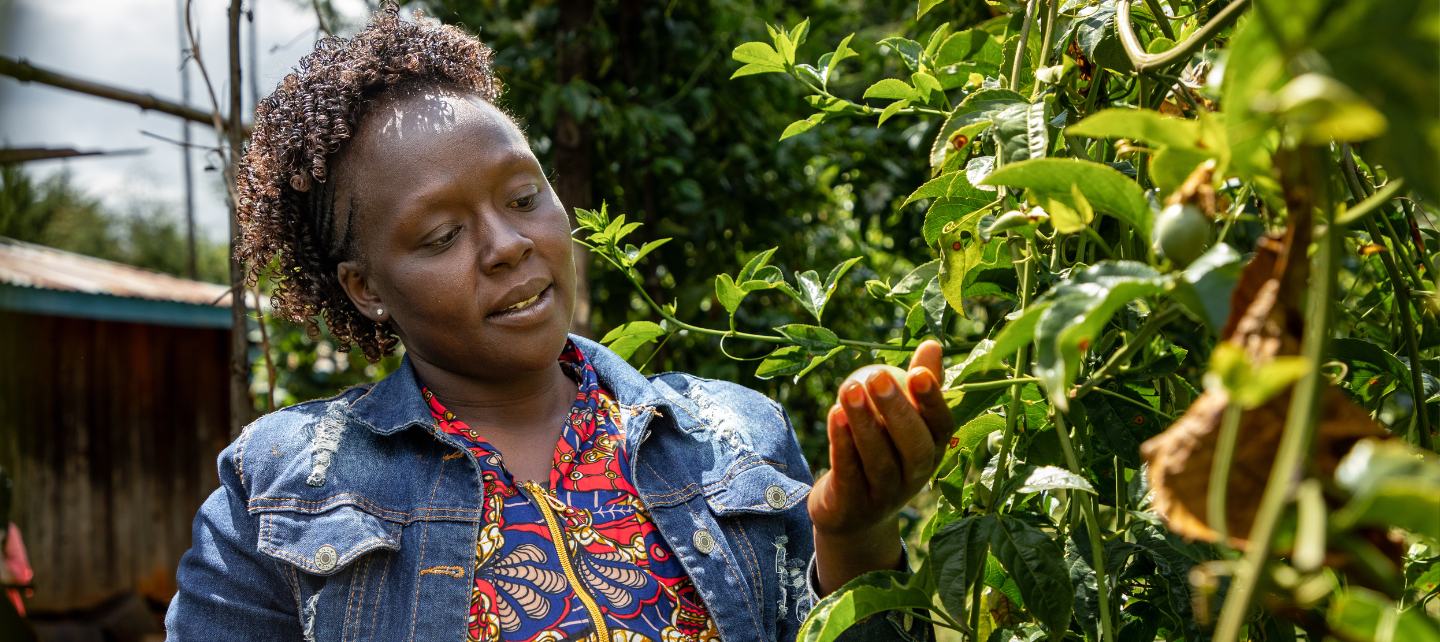 Dorcas Medrich cradles produce on her farm. 