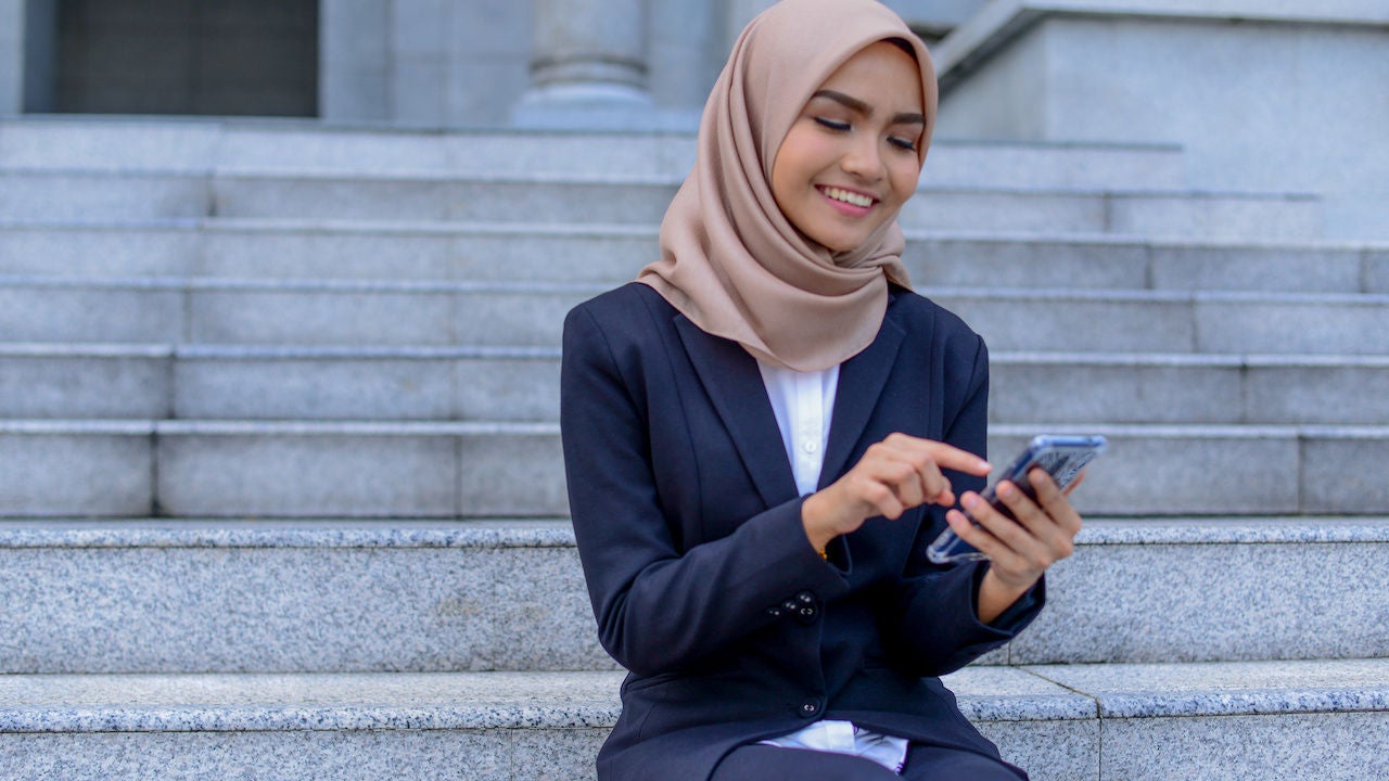 Businesswoman in hijab using-phone