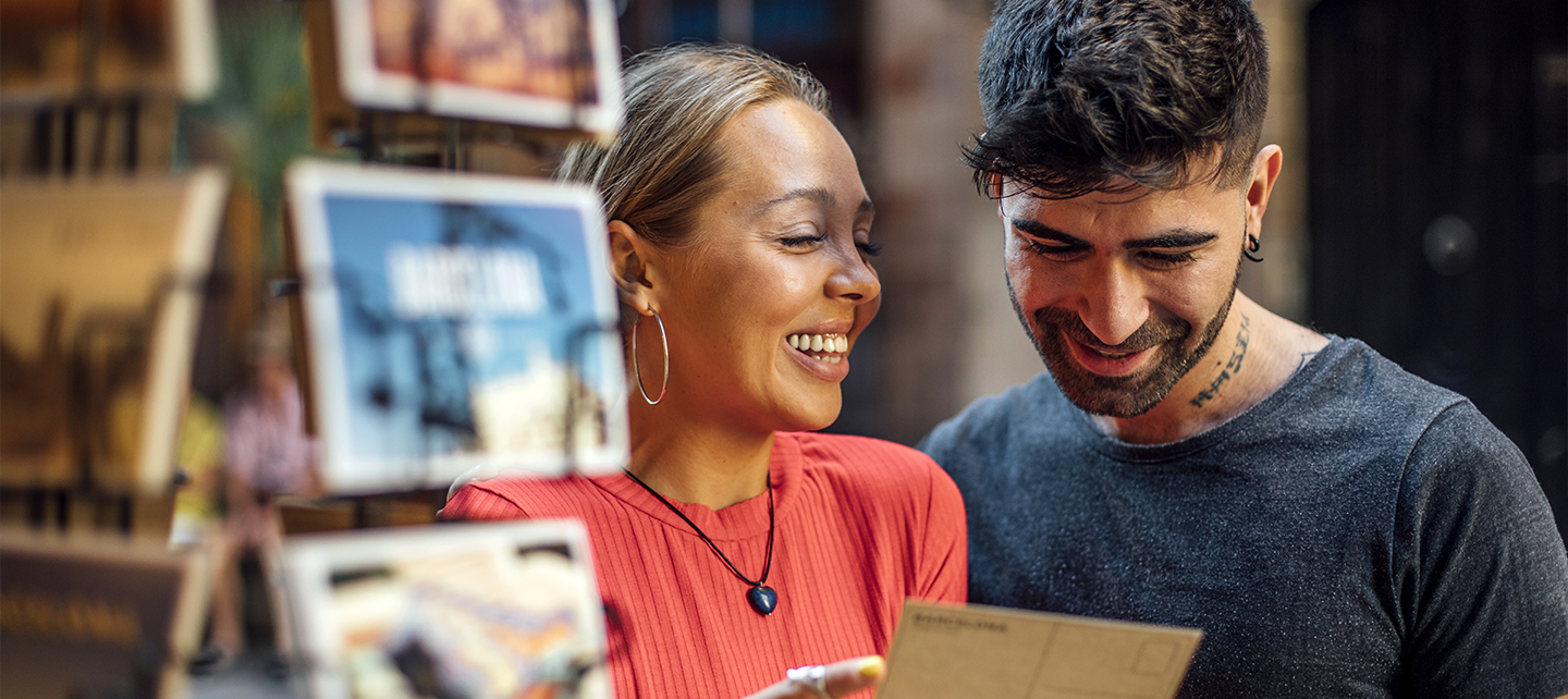 Couple looking at a postcard