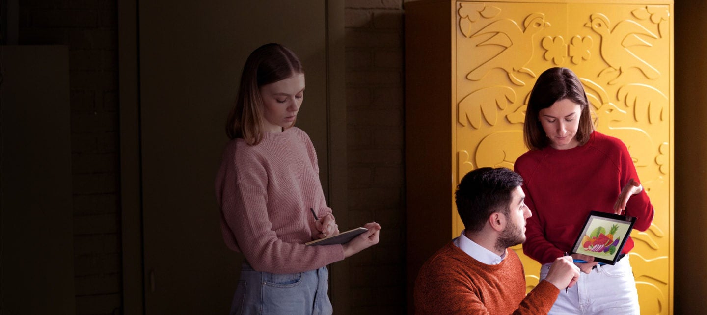 creative team discussing digital artwork