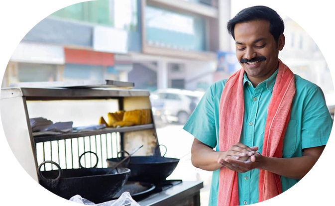 Man standing at his tea stall