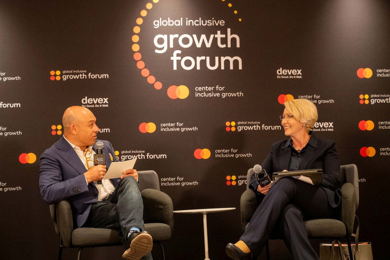 Raj Kumar and  Isabel Chatterton on stage at the Global Inclusive Growth Forum. 