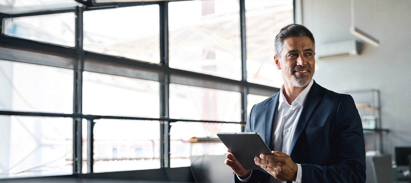 Man holding a tablet at work
