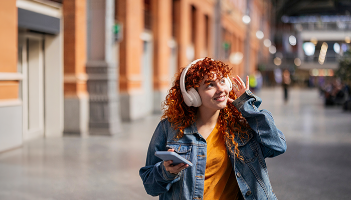 Woman listening to music on her headphones