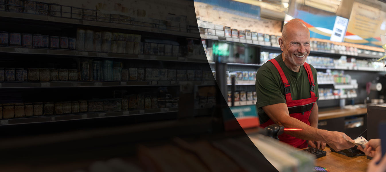 Older man working at a gas station ringing someone up