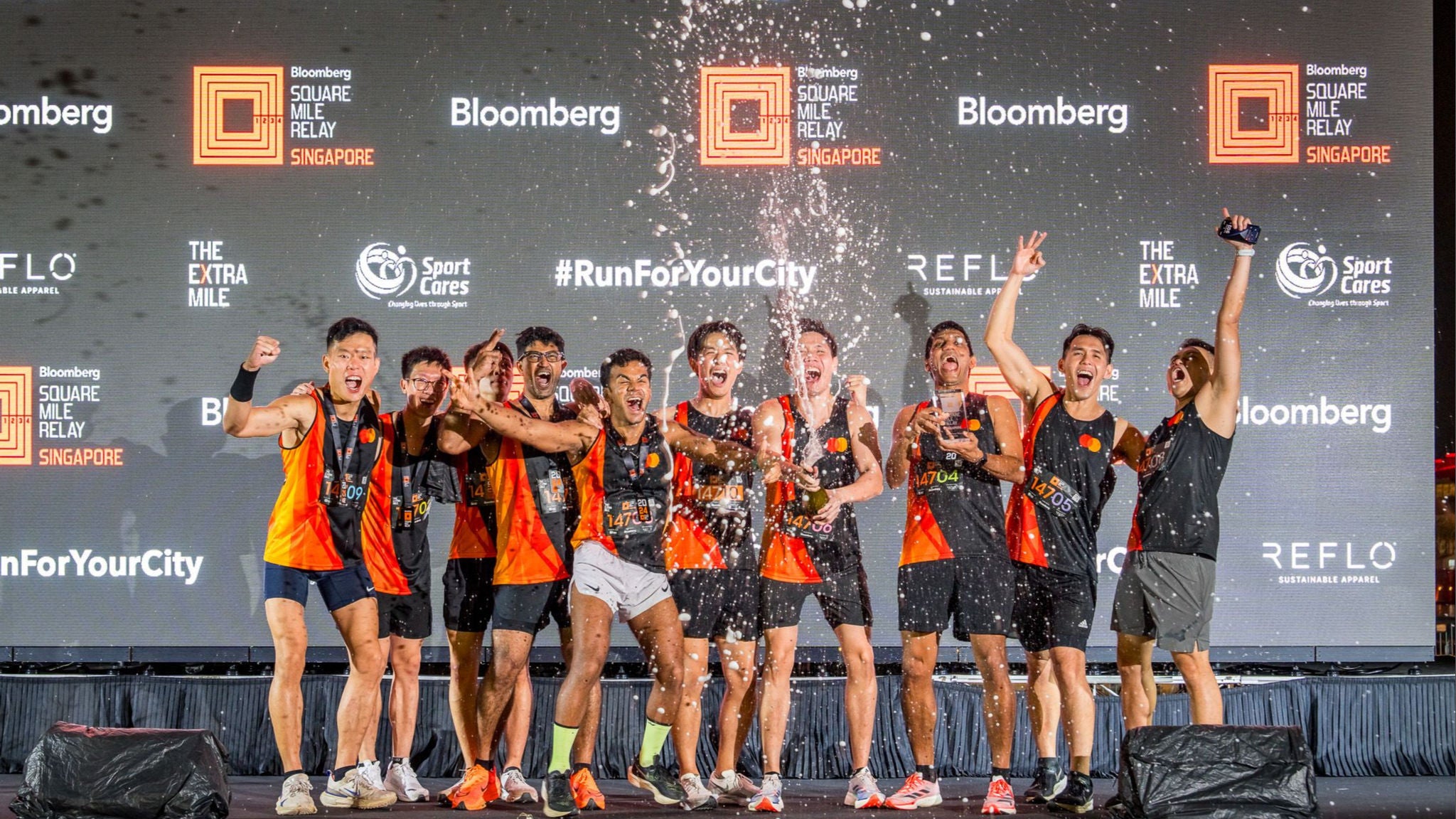 Mastercard runners celebrating their 3rd place win at the Singapore Bloomberg Square Mile Relay on 24 Oct 2024. 