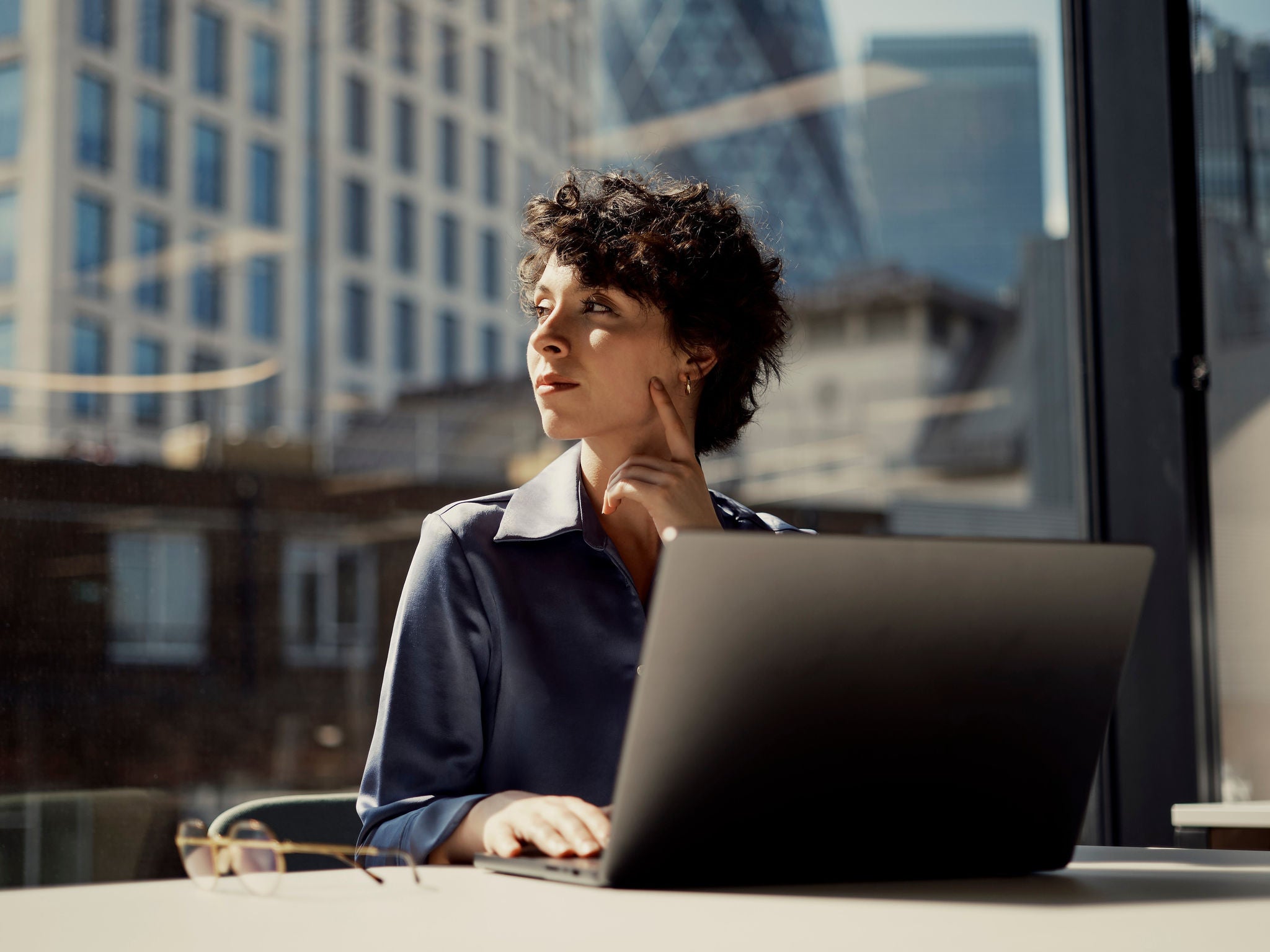 Woman looking over her shoulder in an office