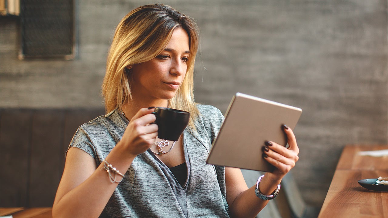 Woman taking a quize on a tablet.