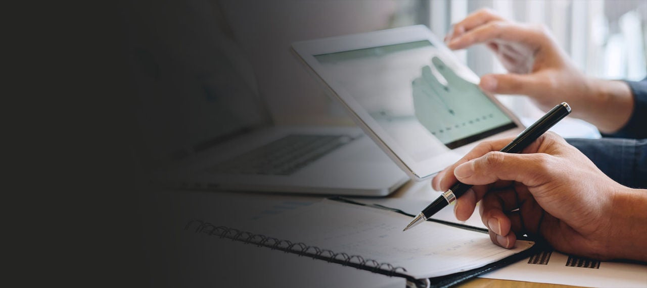 Close up of hand writing with pen.