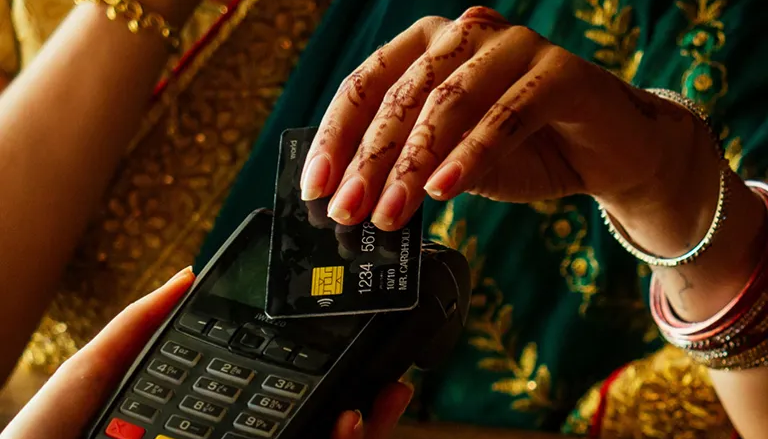 Woman paying for something with contactless payment