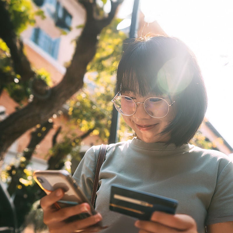 Woman making a payment on her phone