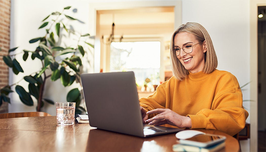 Happy woman working on her computer