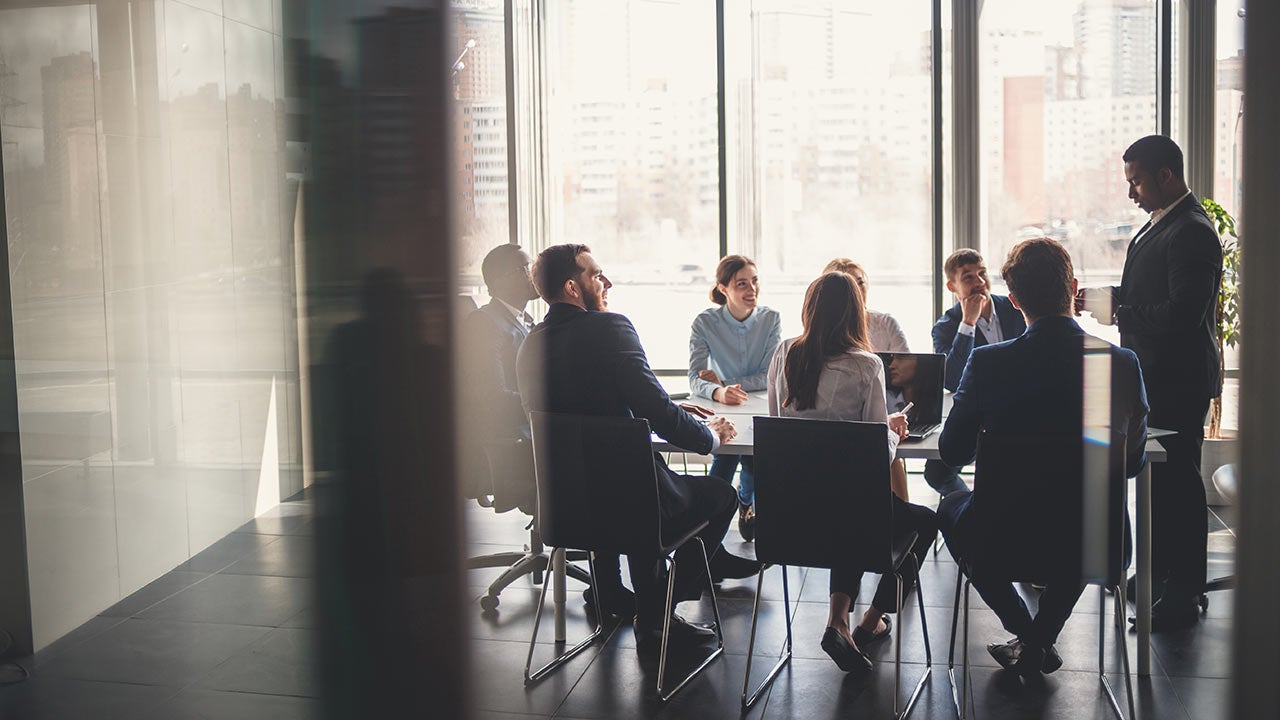 Business people working in a conference room.