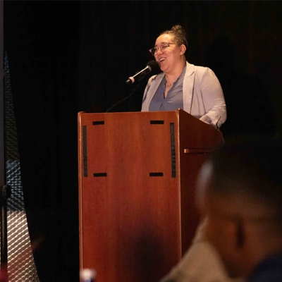 Person speaking at lectern