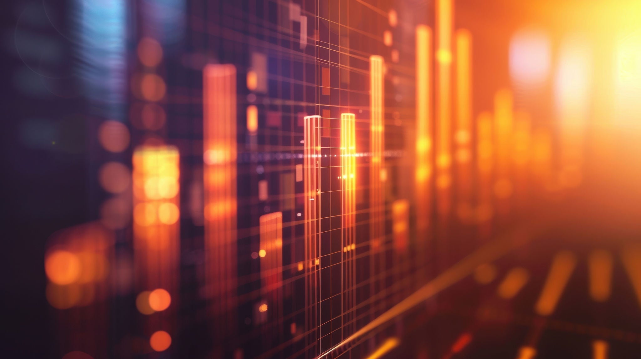 A close up of a graph with orange lines. The graph is showing a downward trend. The image has a mood of uncertainty and instability