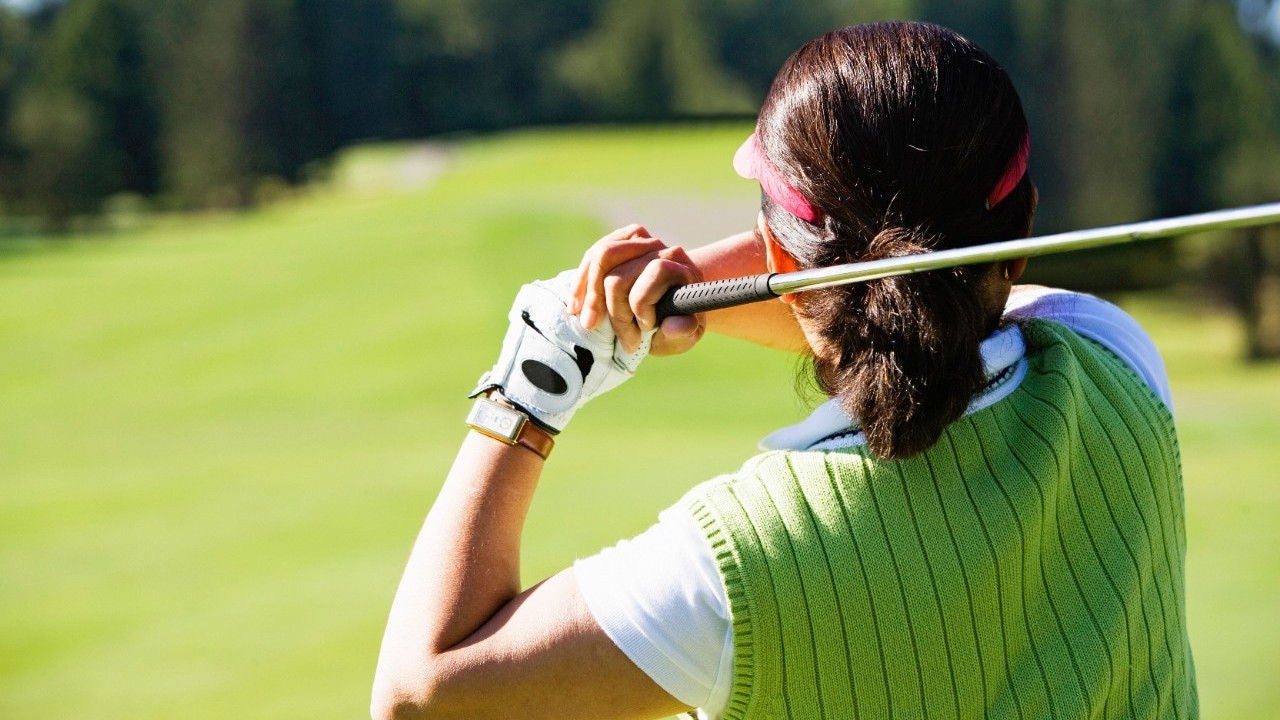 Woman playing golf