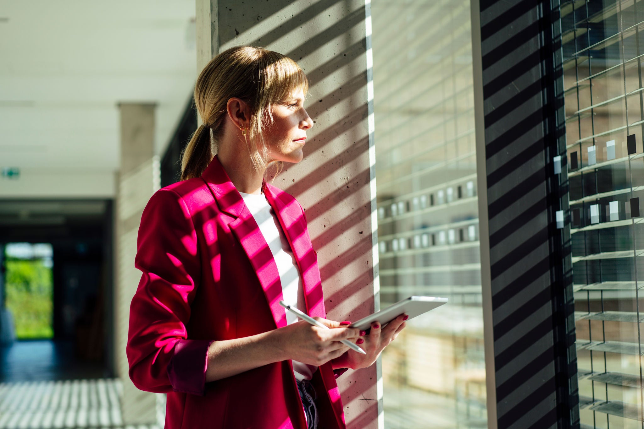 Woman in office looking out window